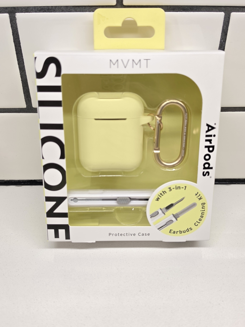 MVMT Pale Yellow Silicone AirPods Case with Gold Carabiner
